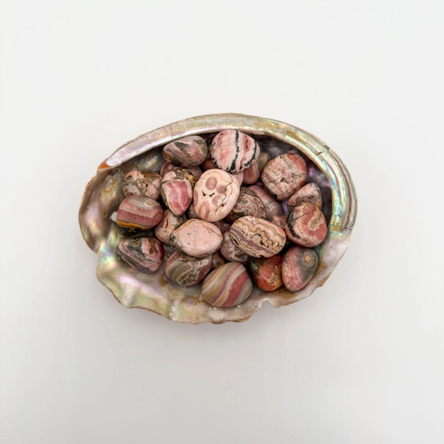 Detail of Rhodochrosite tumbled stone, showing earthy tone.