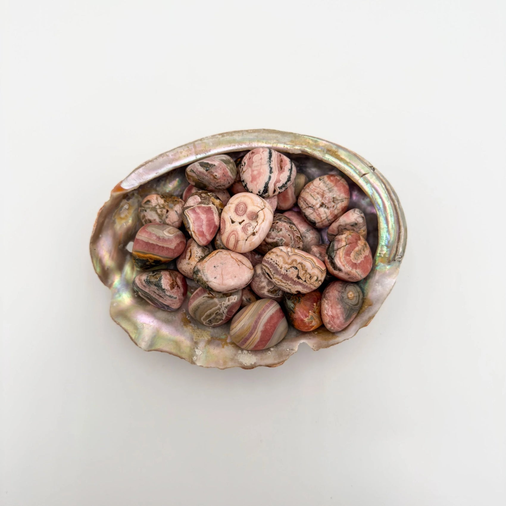 Detail of Rhodochrosite tumbled stone, showing earthy tone.