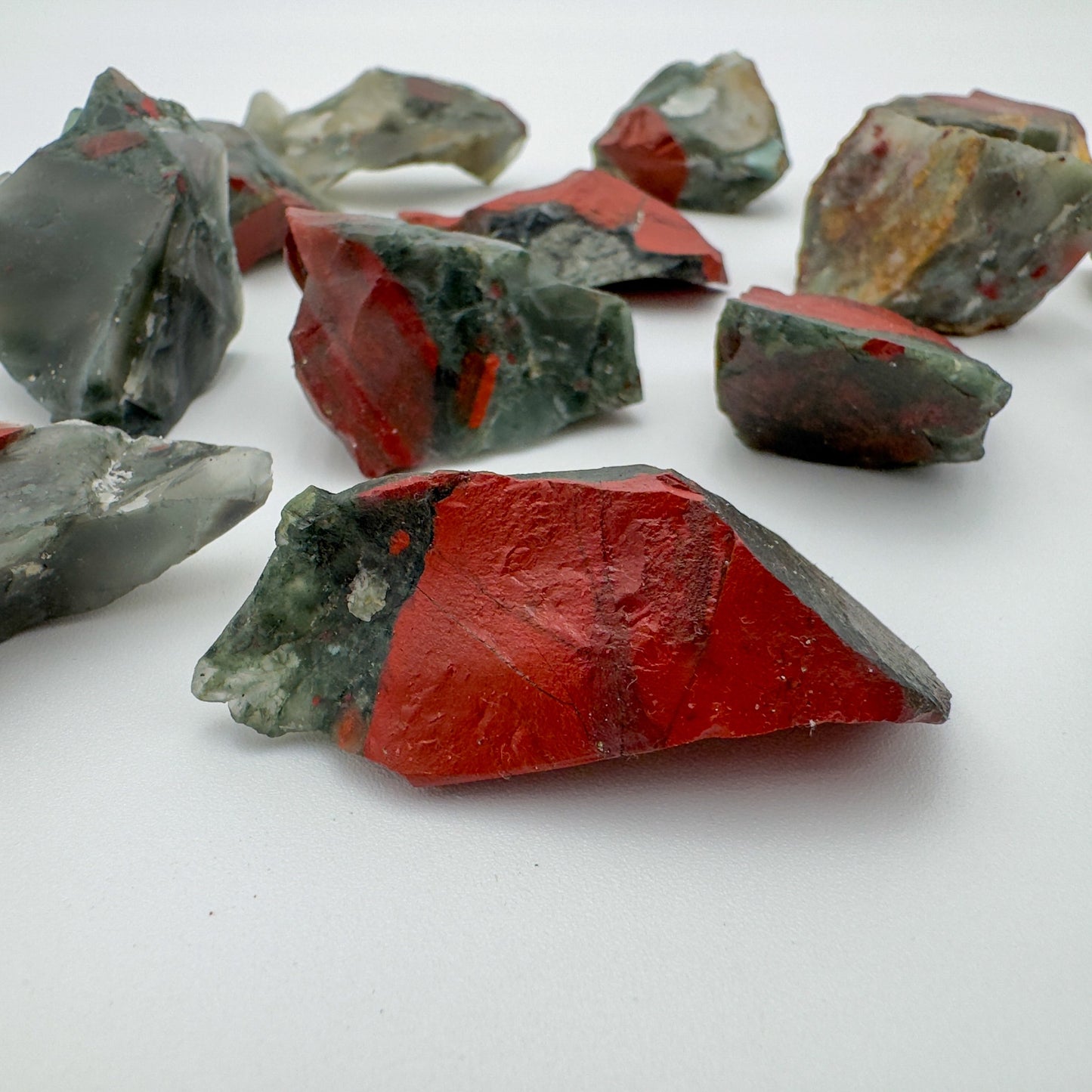 Top-down shot of Grade AA Bloodstone raw stone, from Eswatini, showing tight grain.