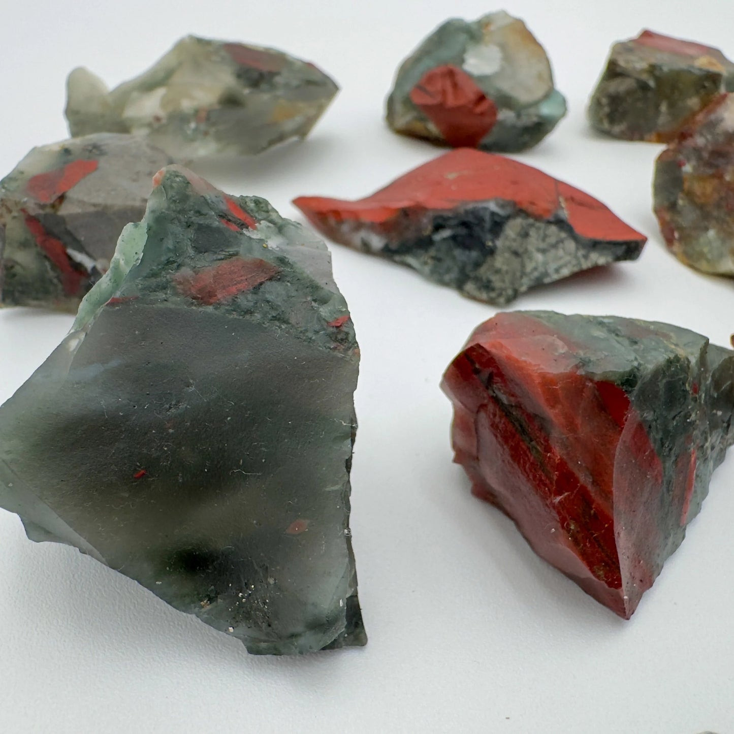 Held in hand, a Bloodstone raw stone, from Eswatini.