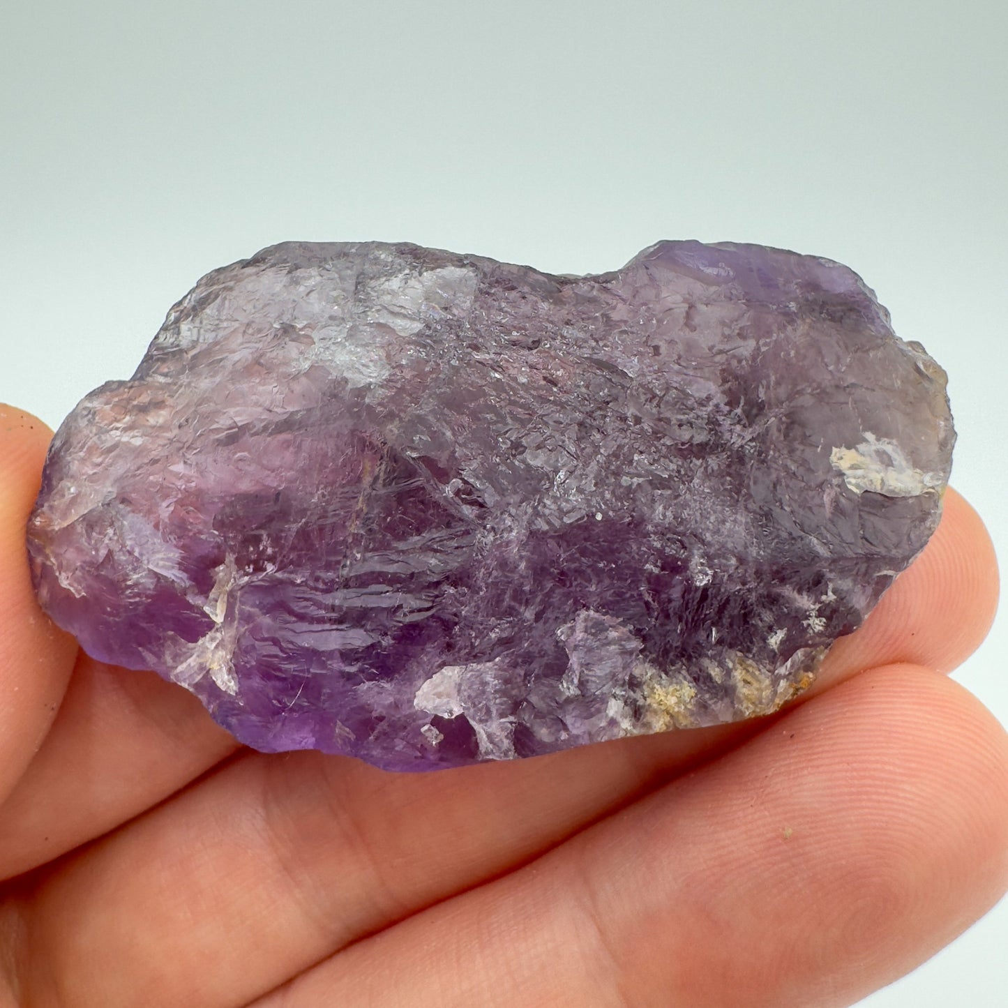 Back view of Grade AA Amethyst raw showing natural surface