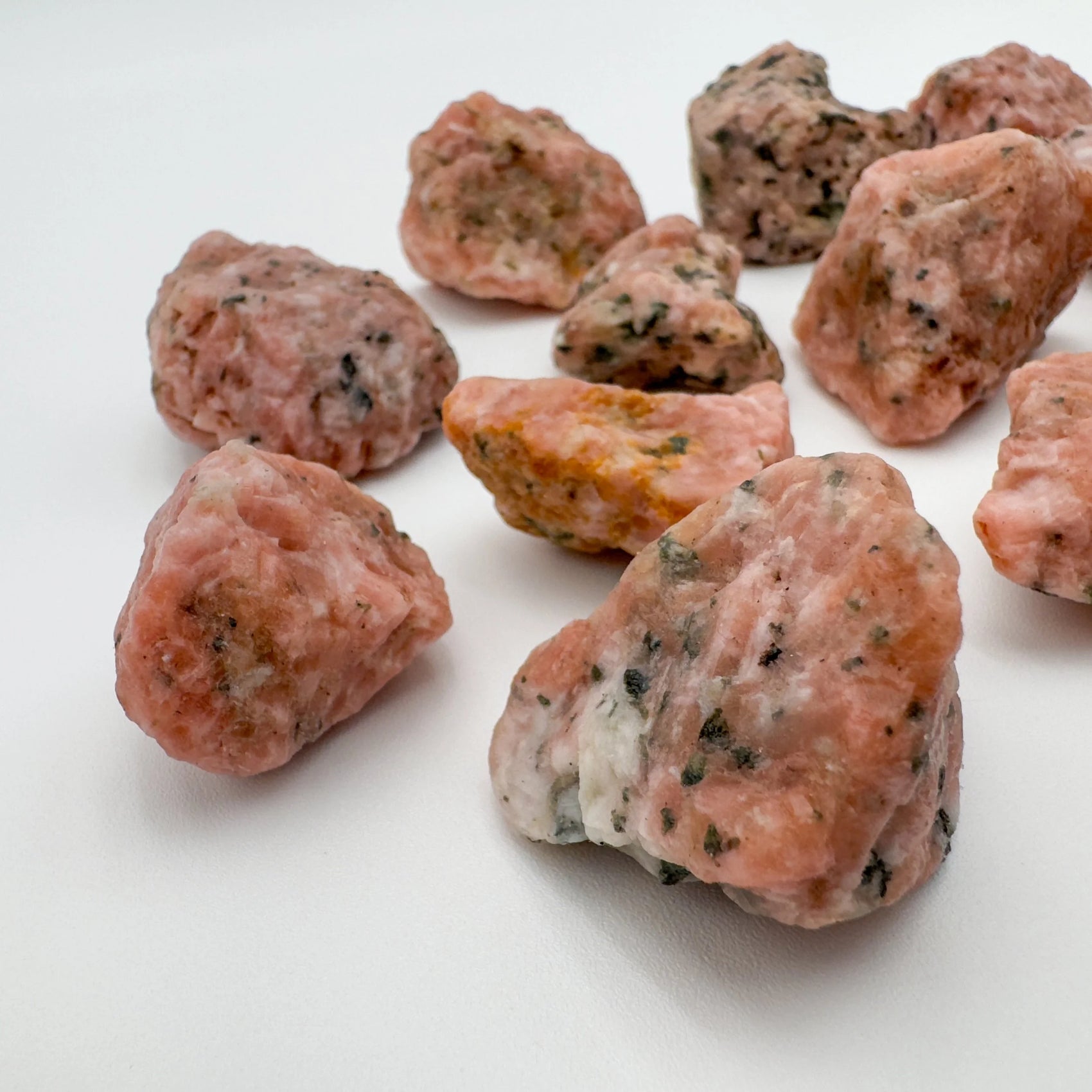 Looking down on Orange Calcite raw stone, showing natural color depth, often worked with for Energy.