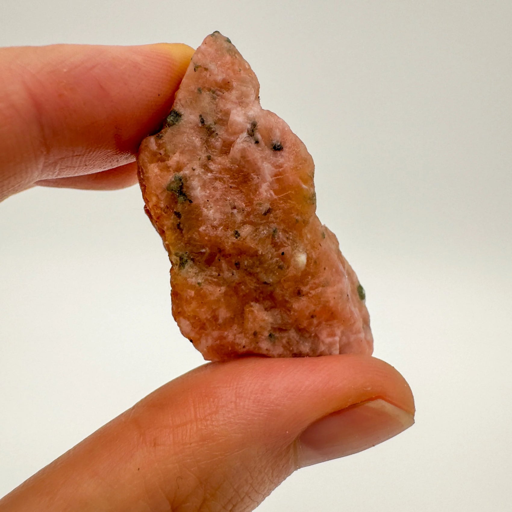 Detail shot of Grade A Orange Calcite raw under natural light