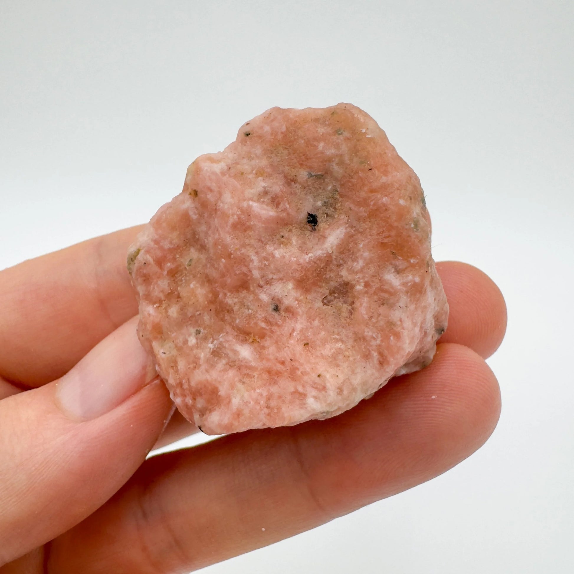 Back view of Grade A Orange Calcite raw showing natural surface