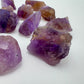 Side profile of Grade AA Ametrine raw with natural form and inclusions