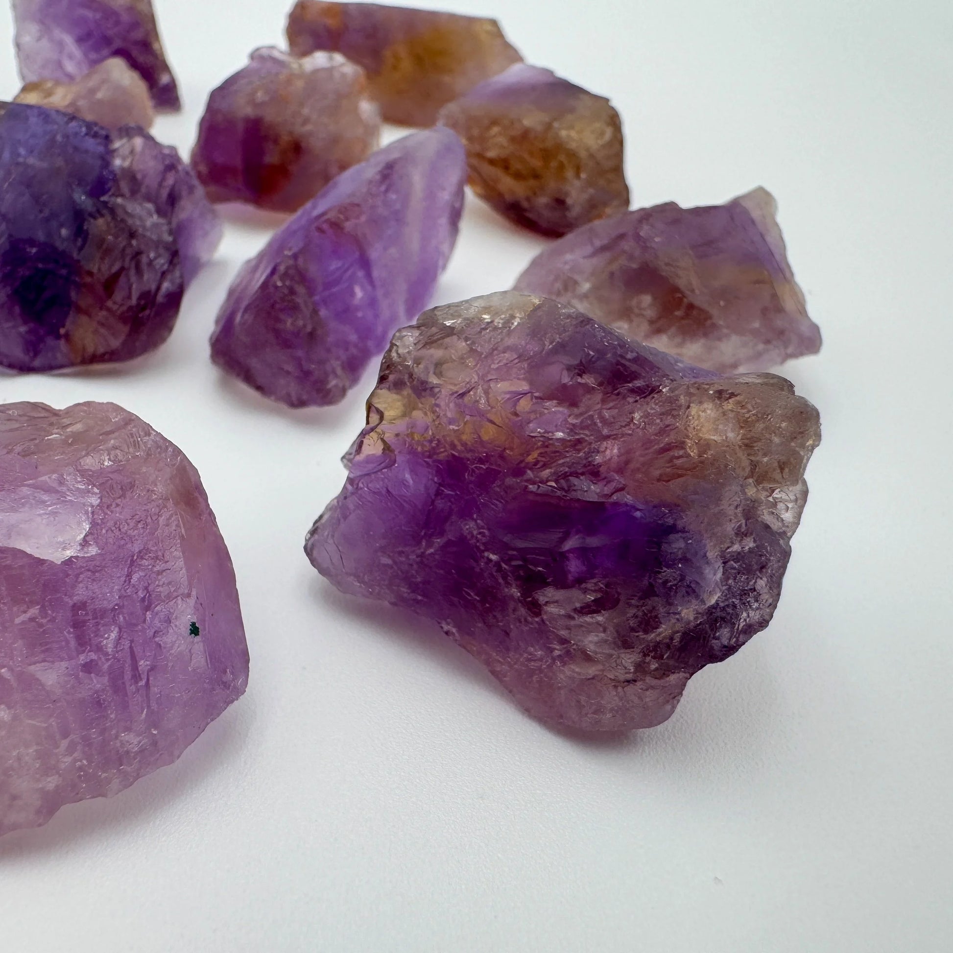 Side profile of Grade AA Ametrine raw with natural form and inclusions