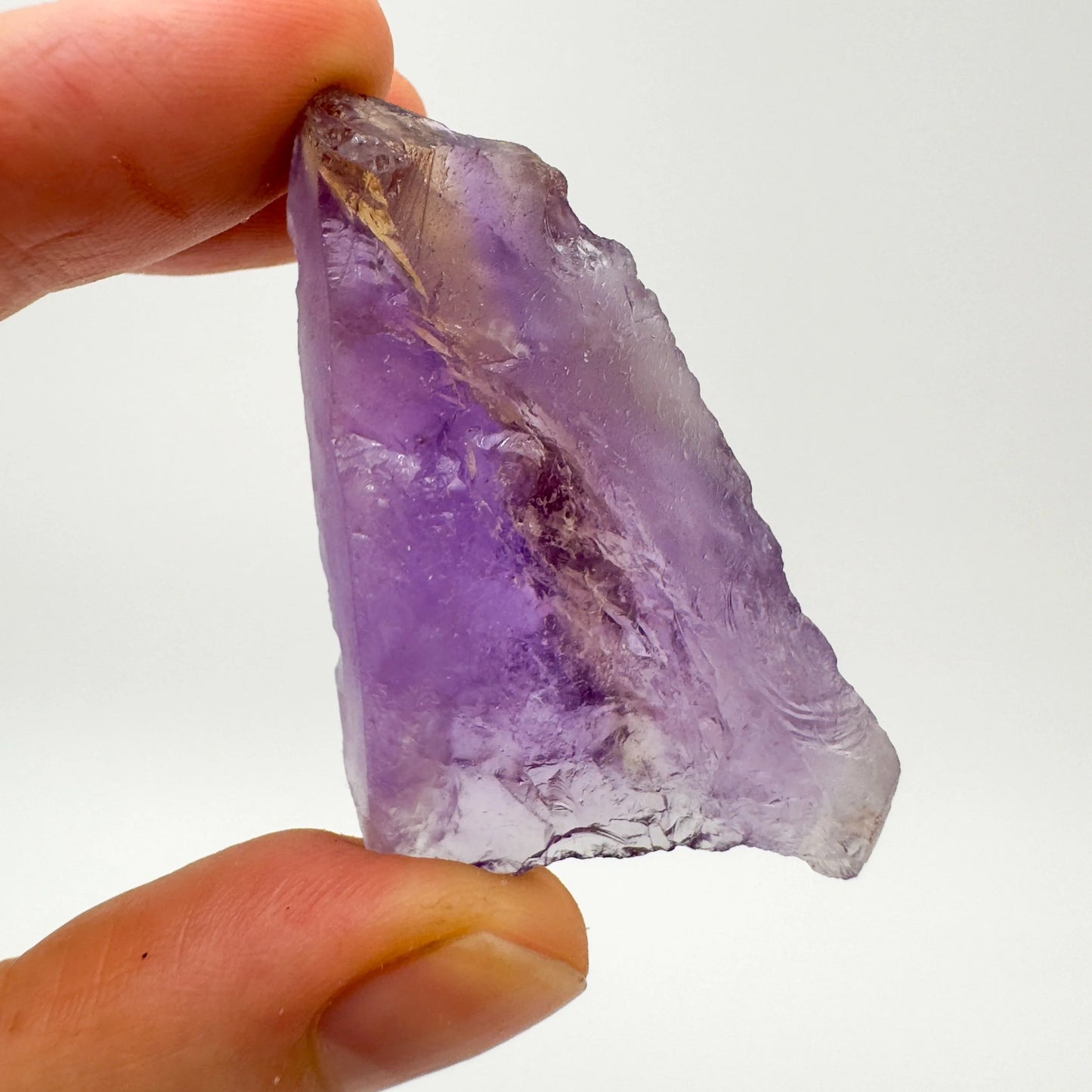 Close-up detail of Grade AA Ametrine raw showing natural purple, yellow tones and texture