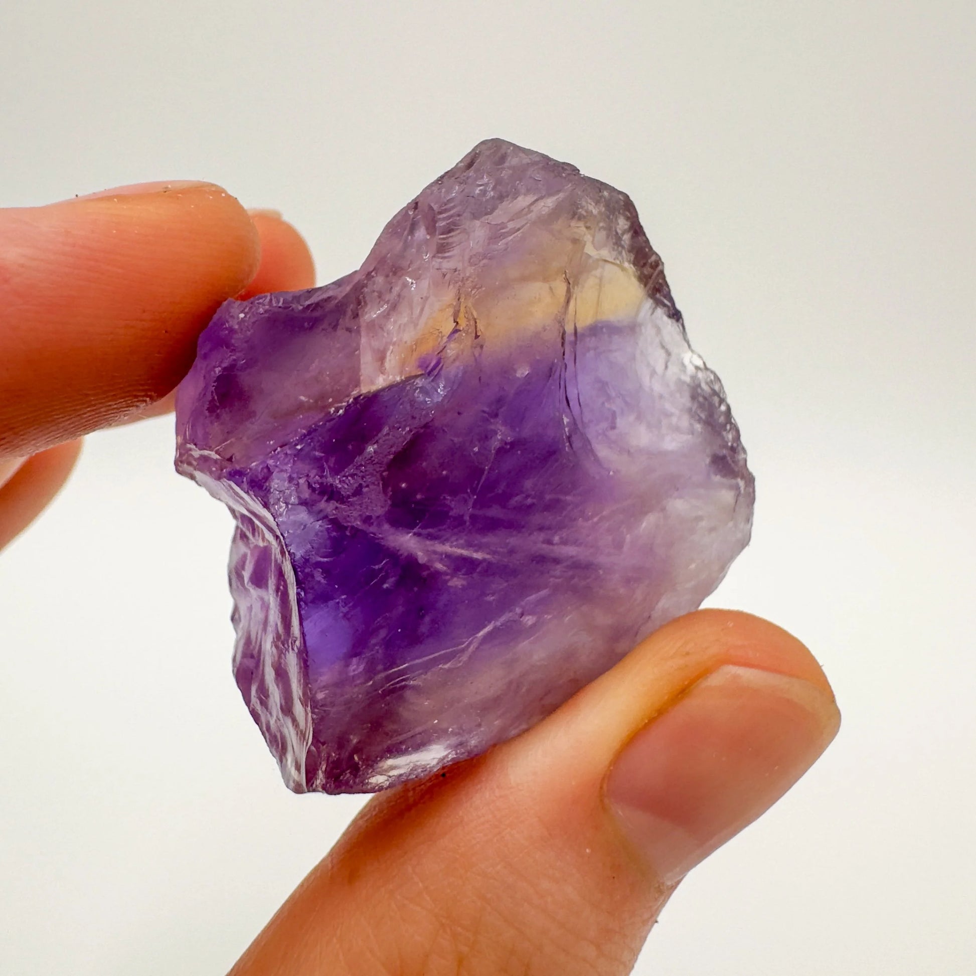 Back view of Grade AA Ametrine raw showing natural surface