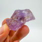 Detail shot of Grade AA Ametrine raw under natural light