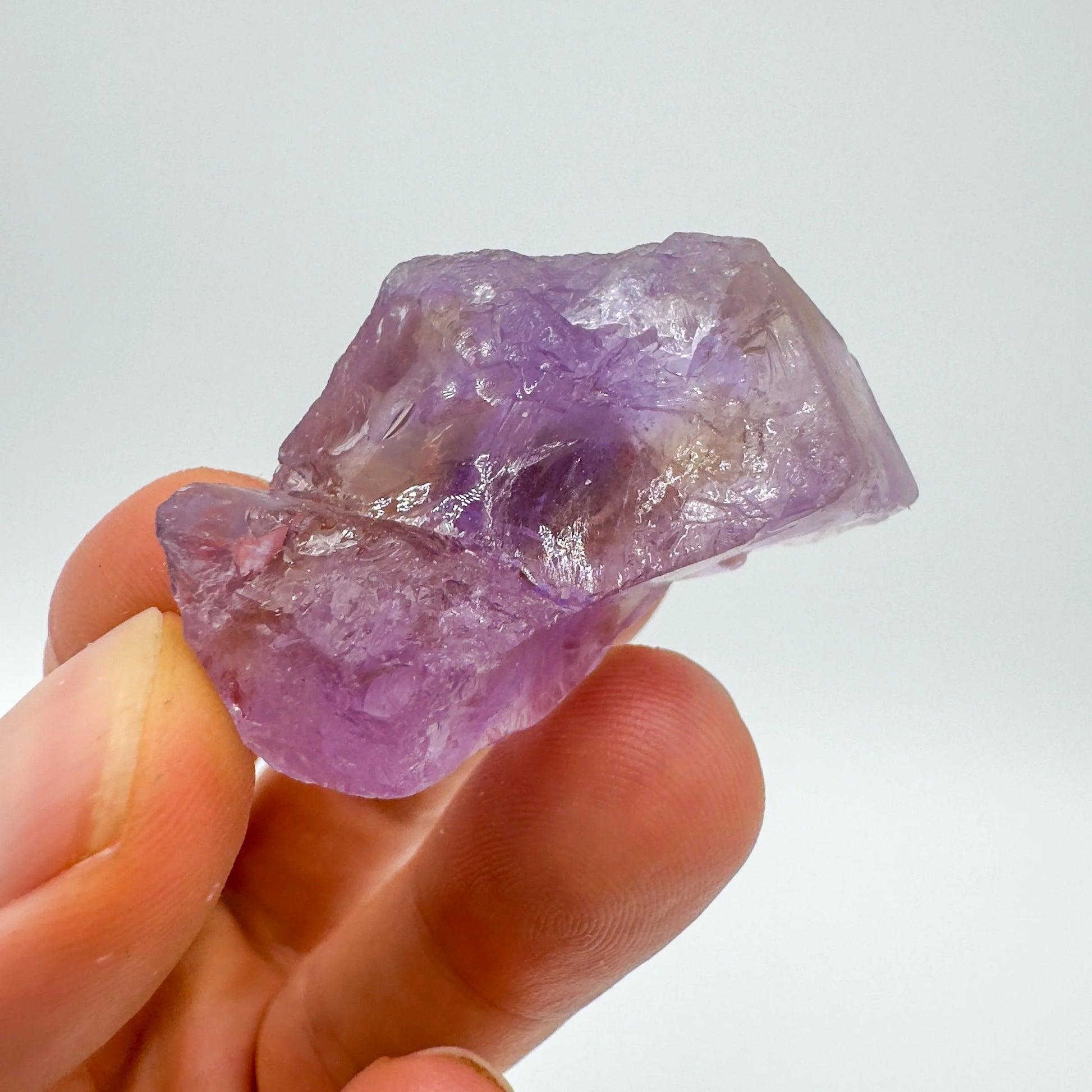 Detail shot of Grade AA Ametrine raw under natural light