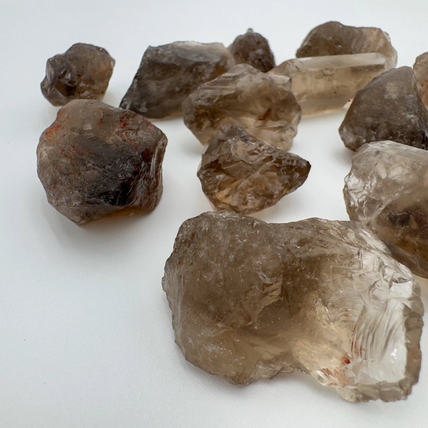 Side-on view of Grade AA Smoky Quartz raw stone, showing natural variation.