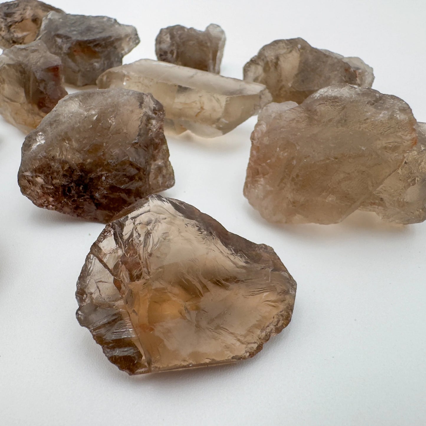 Plan view of brown Smoky Quartz raw stone, showing natural color depth.