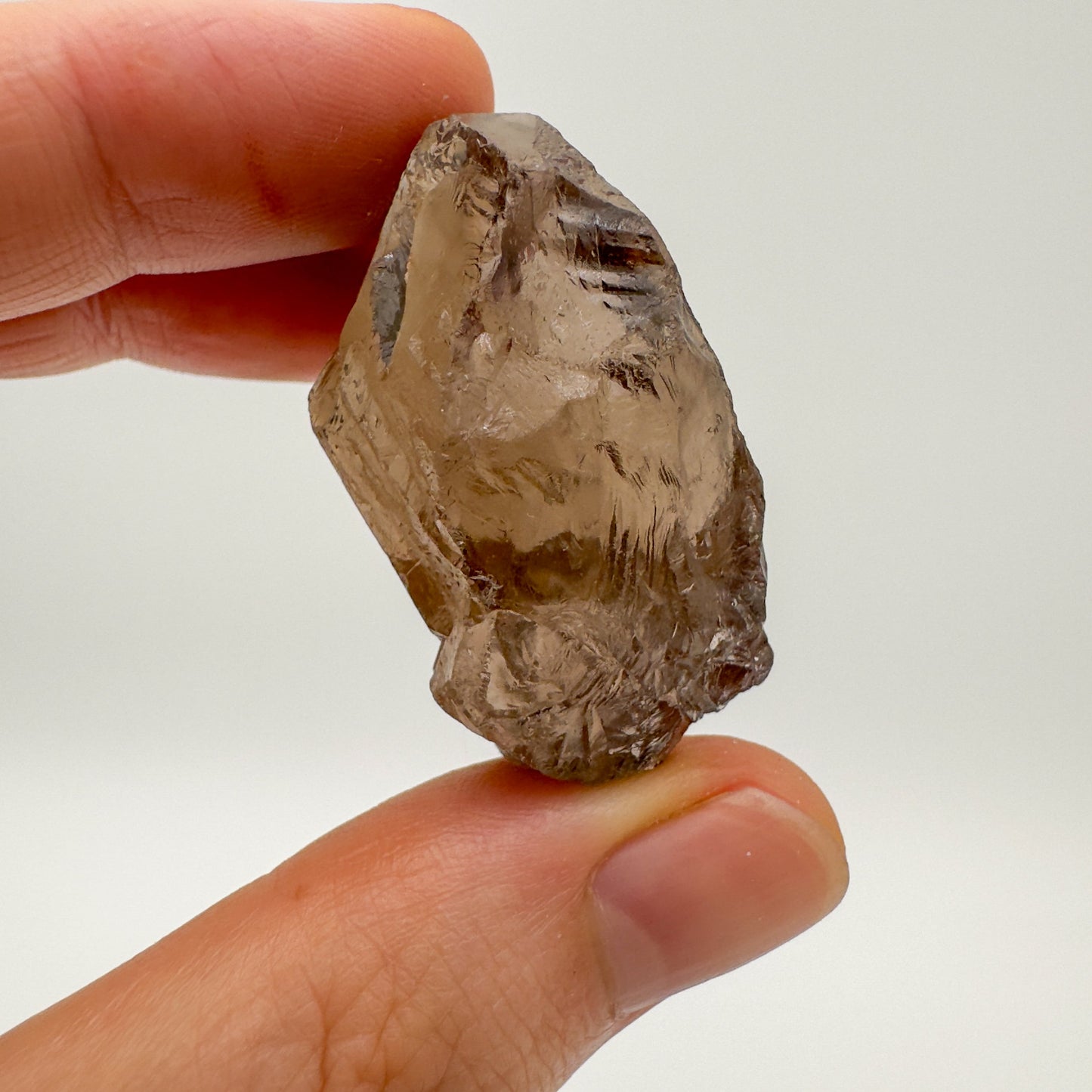 Full piece view of Smoky Quartz raw crystal, shown for size reference.