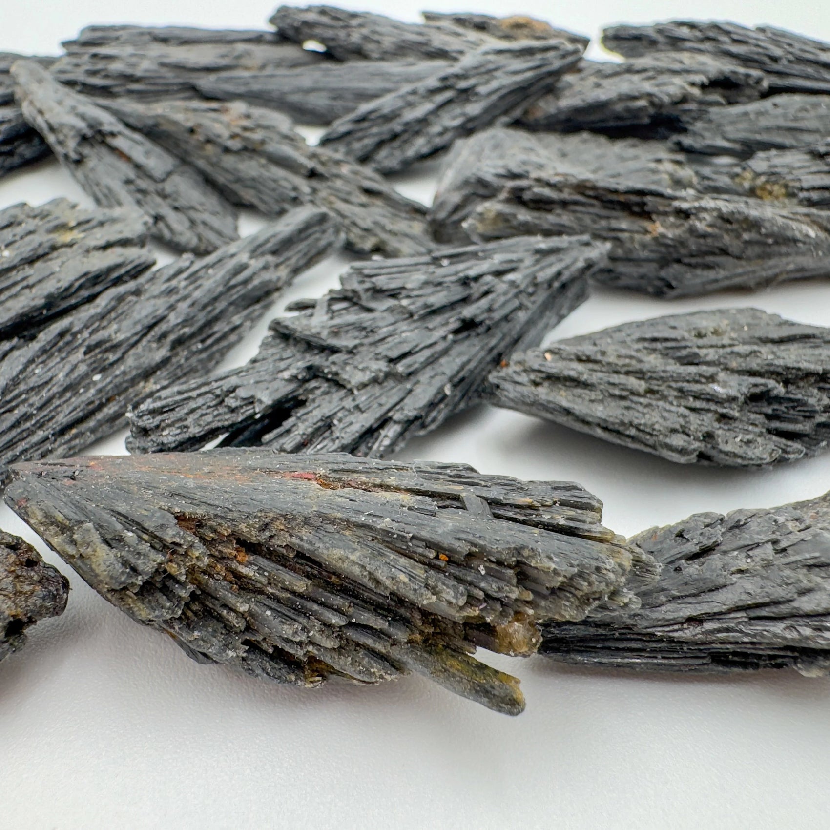 Close-up of Black Kyanite raw crystal from Brazil, soothing wellness stone for Stress Relief