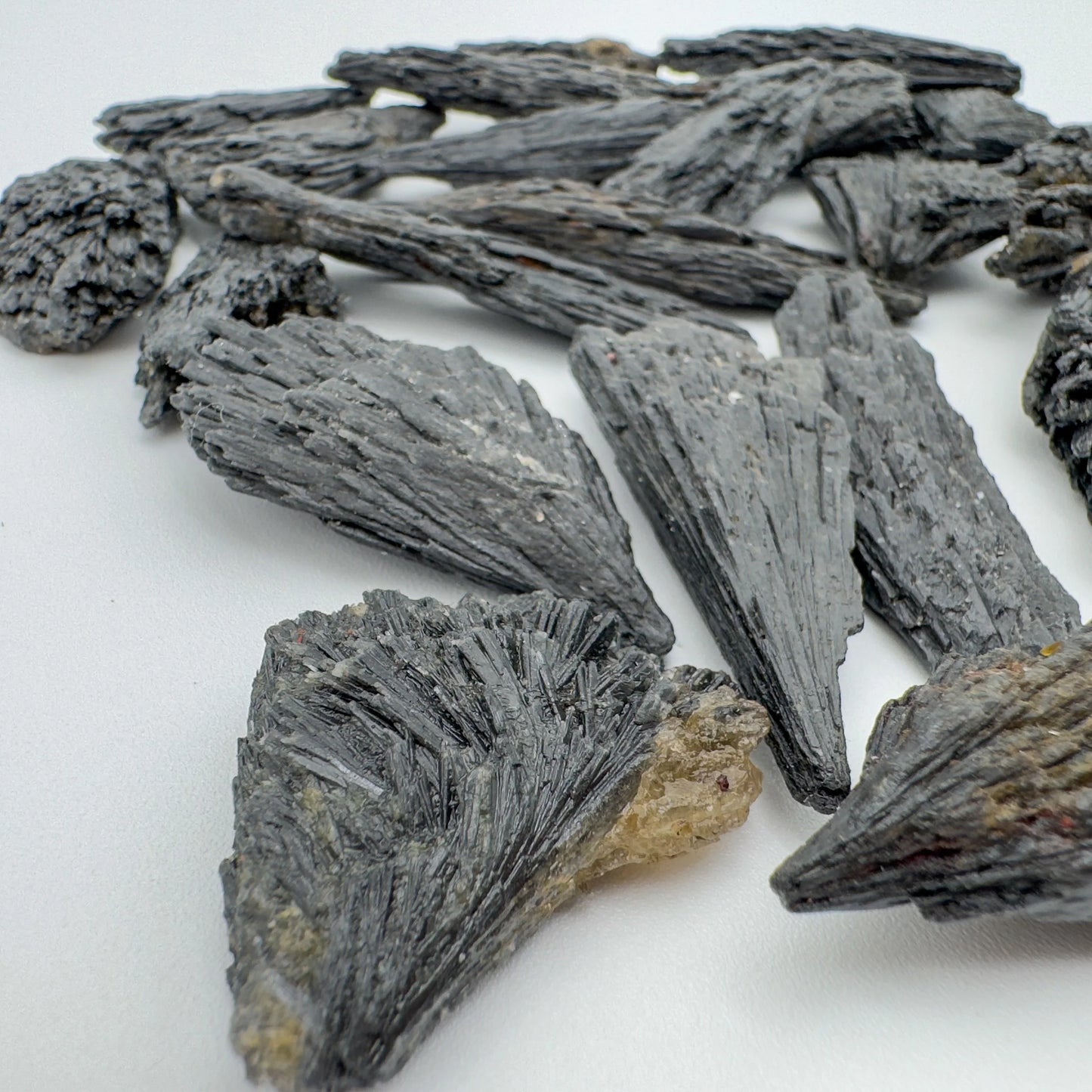 Opposite side of Black Kyanite raw stone, showing characteristic patterning.