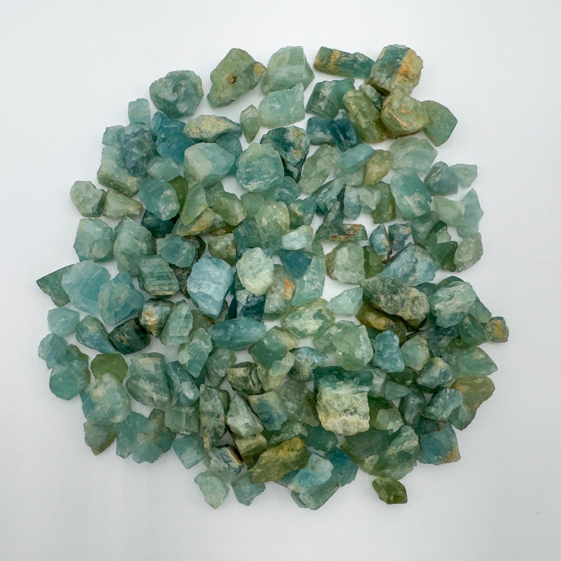 Detail shot showing Aquamarine raw stone, showing natural patina.