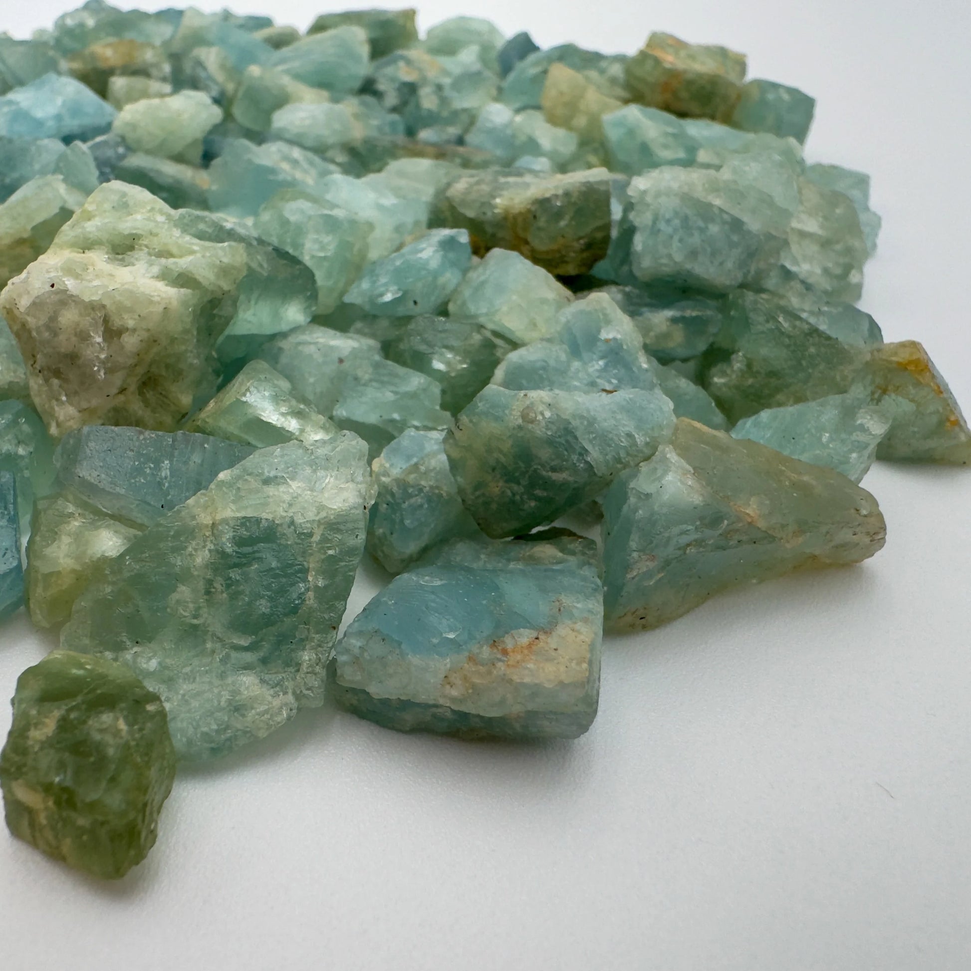 Rear view of Aquamarine raw stone, showing natural patina, from Angola.