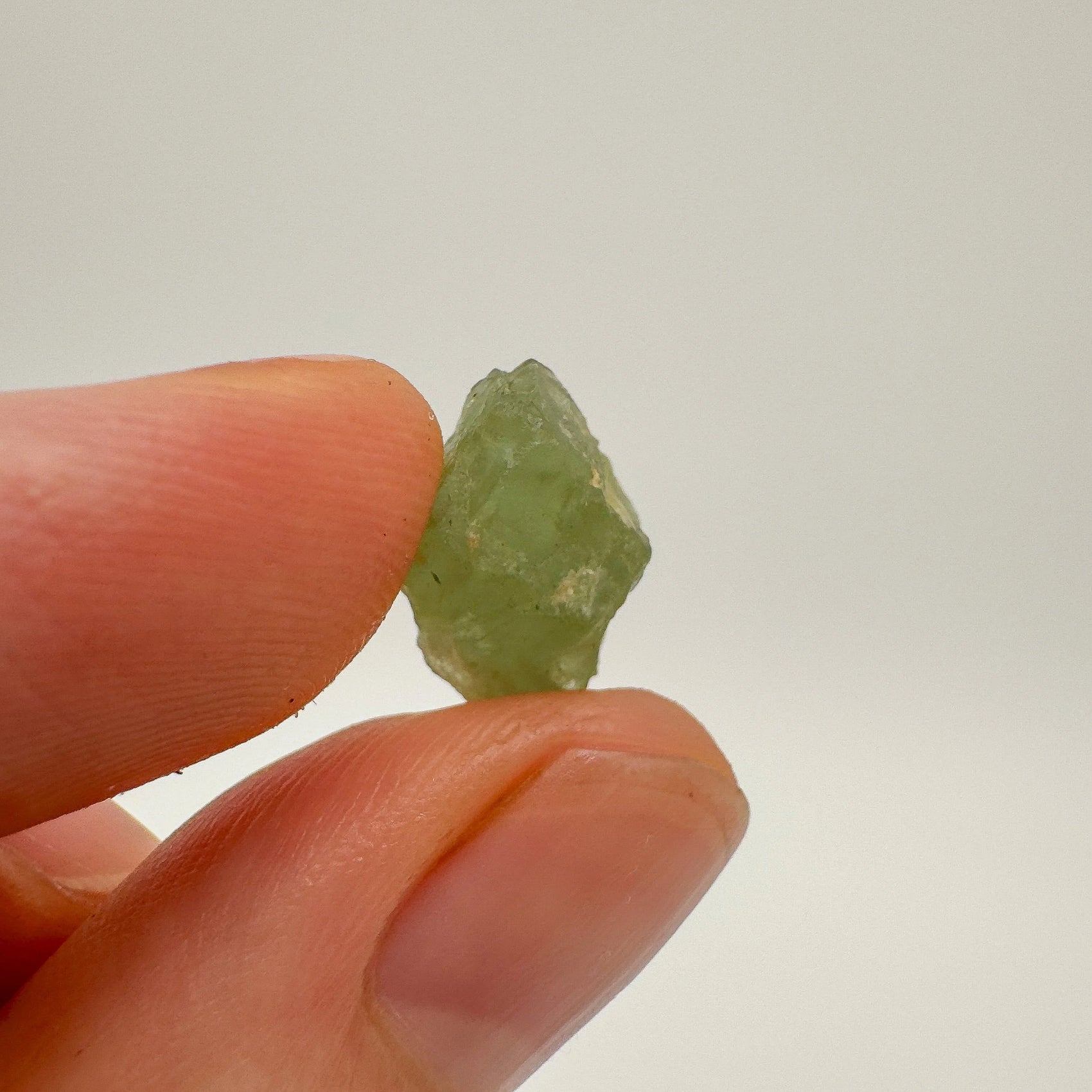 Back view of Grade A Aquamarine raw showing natural surface