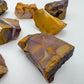 Profile view of Grade AA Mookaite raw stone, showing natural form, traditionally used for Grounding.