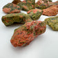 Detail of Unakite raw stone, showing characteristic finish.