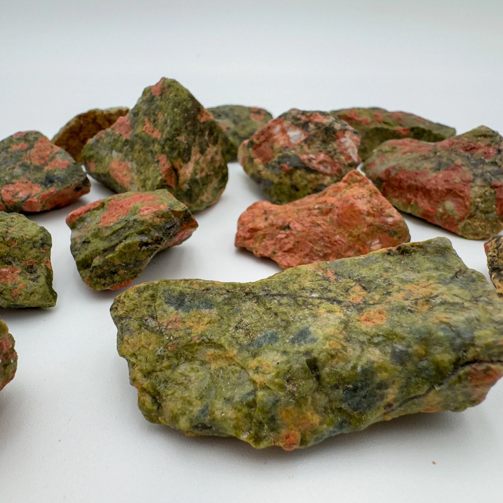 Profile view of Grade AA Unakite raw stone, for Emotional Healing.