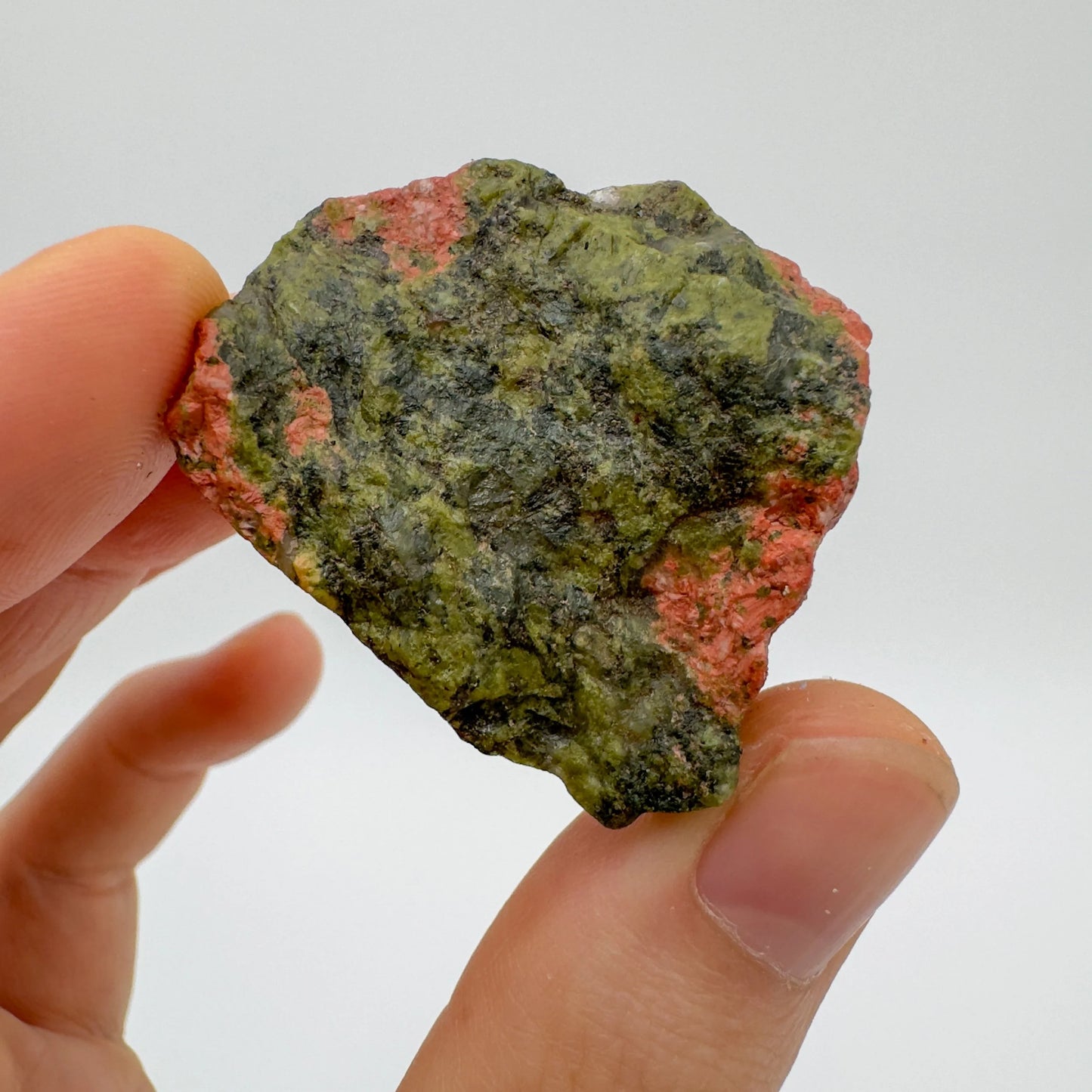 Back view of Grade AA Unakite raw showing natural surface