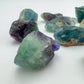 Edge-on view of purple Fluorite raw stone, showing characteristic patterning, sourced from Erongo, Namibia.