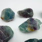 Back view of Fluorite raw stone, showing natural texture.