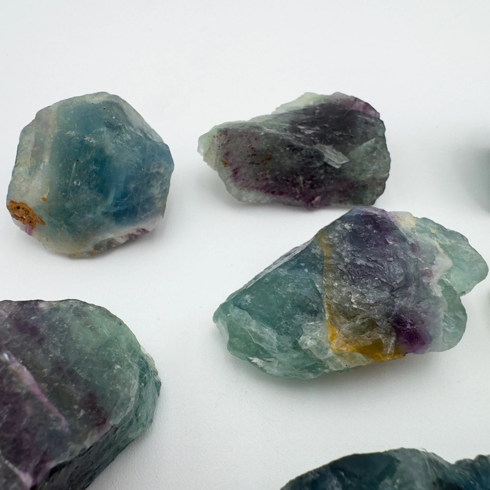 Back view of Fluorite raw stone, showing natural texture.