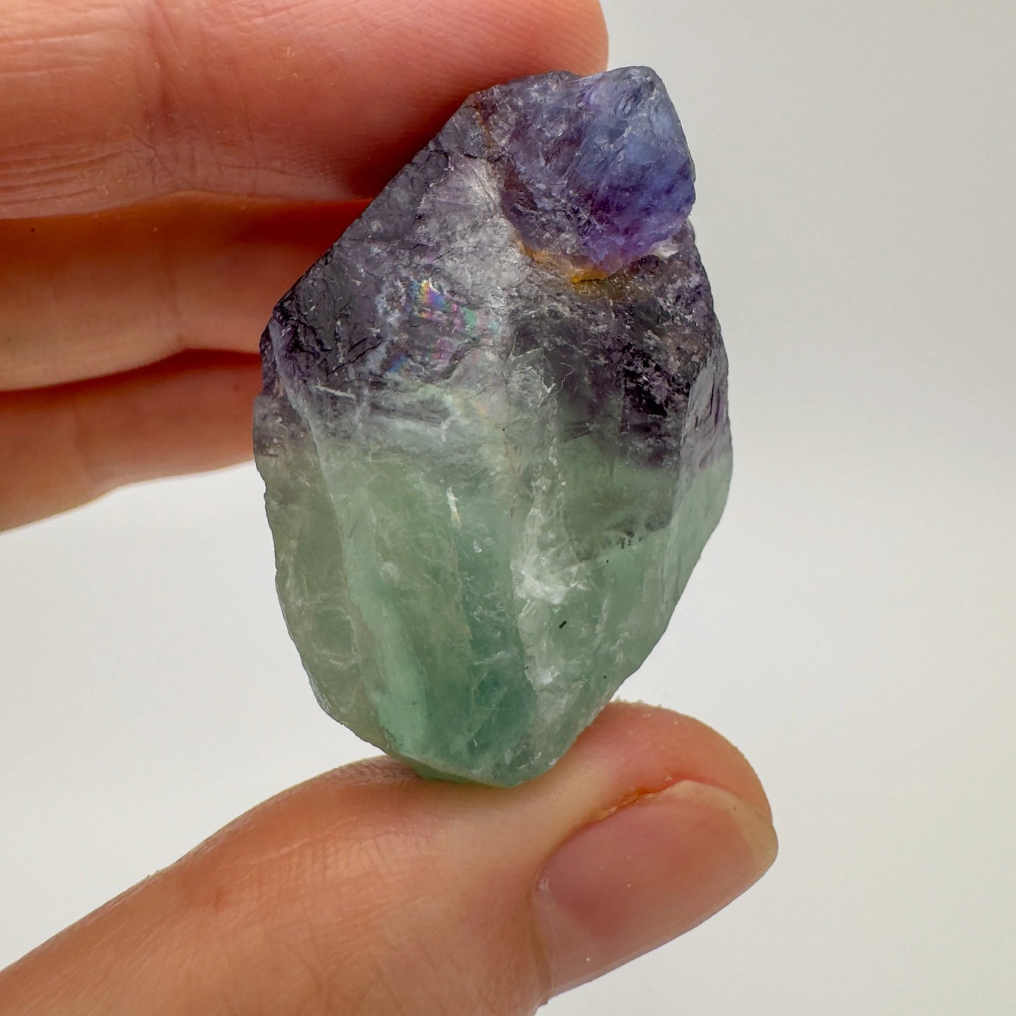 Back view of Grade AA Fluorite raw showing natural surface