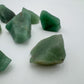 Top angle of green Aventurine raw stone, showing characteristic patterning, Brazil-sourced.