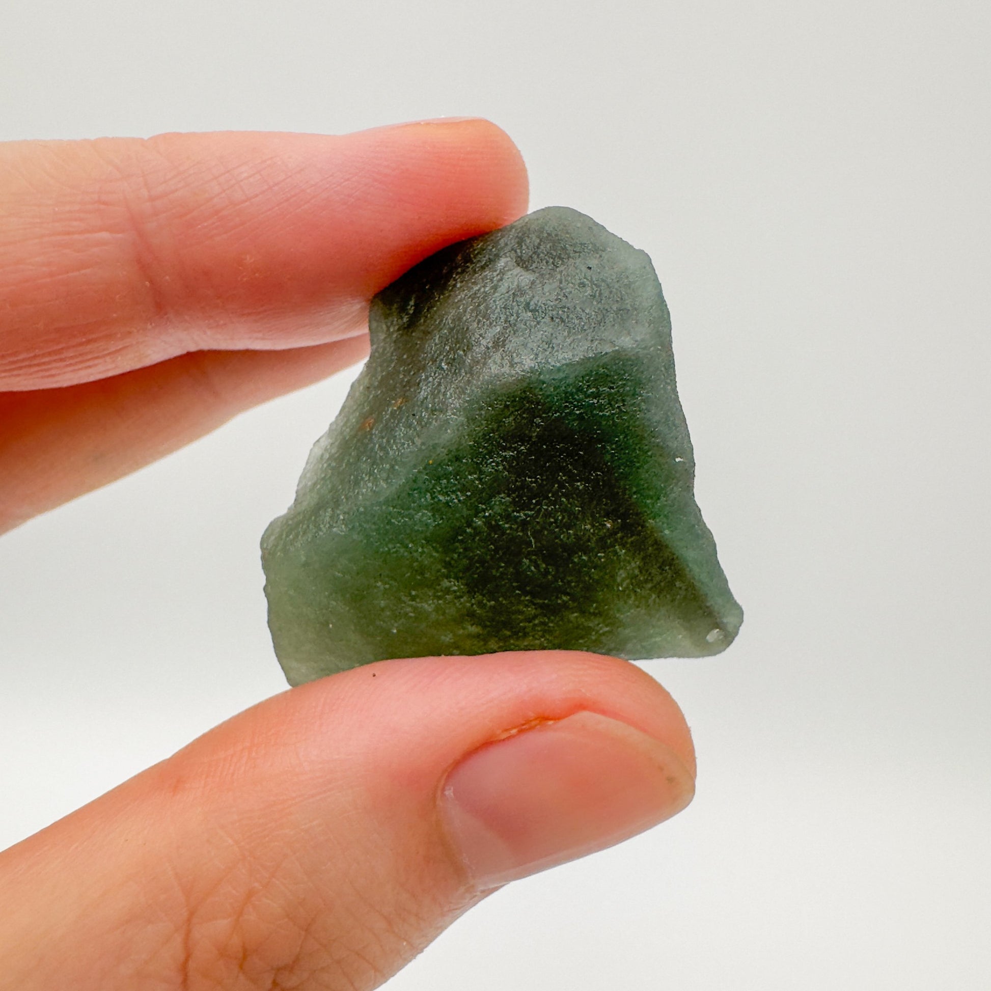 Underside detail of Grade AA Aventurine raw stone, showing characteristic color, linked to Luck.