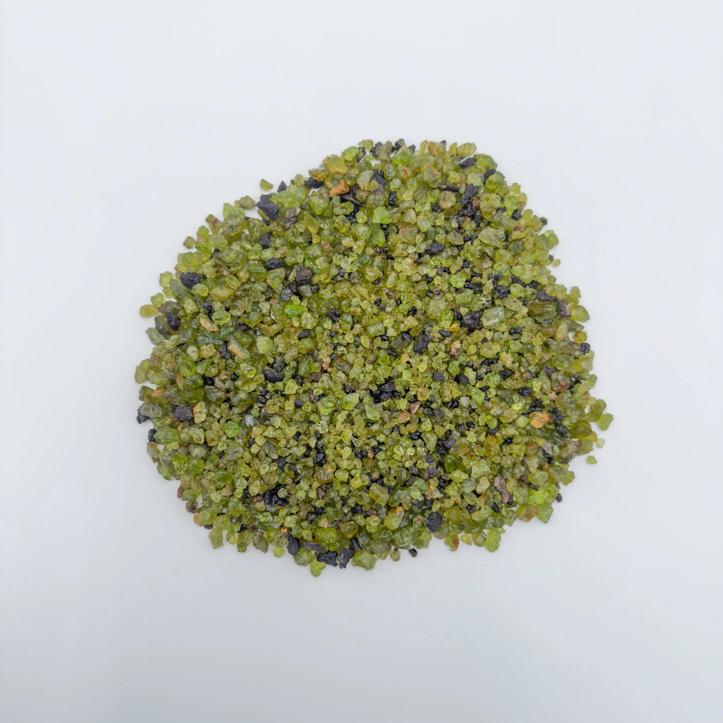 Close-up detail of Grade AA Peridot raw showing natural green tones and texture