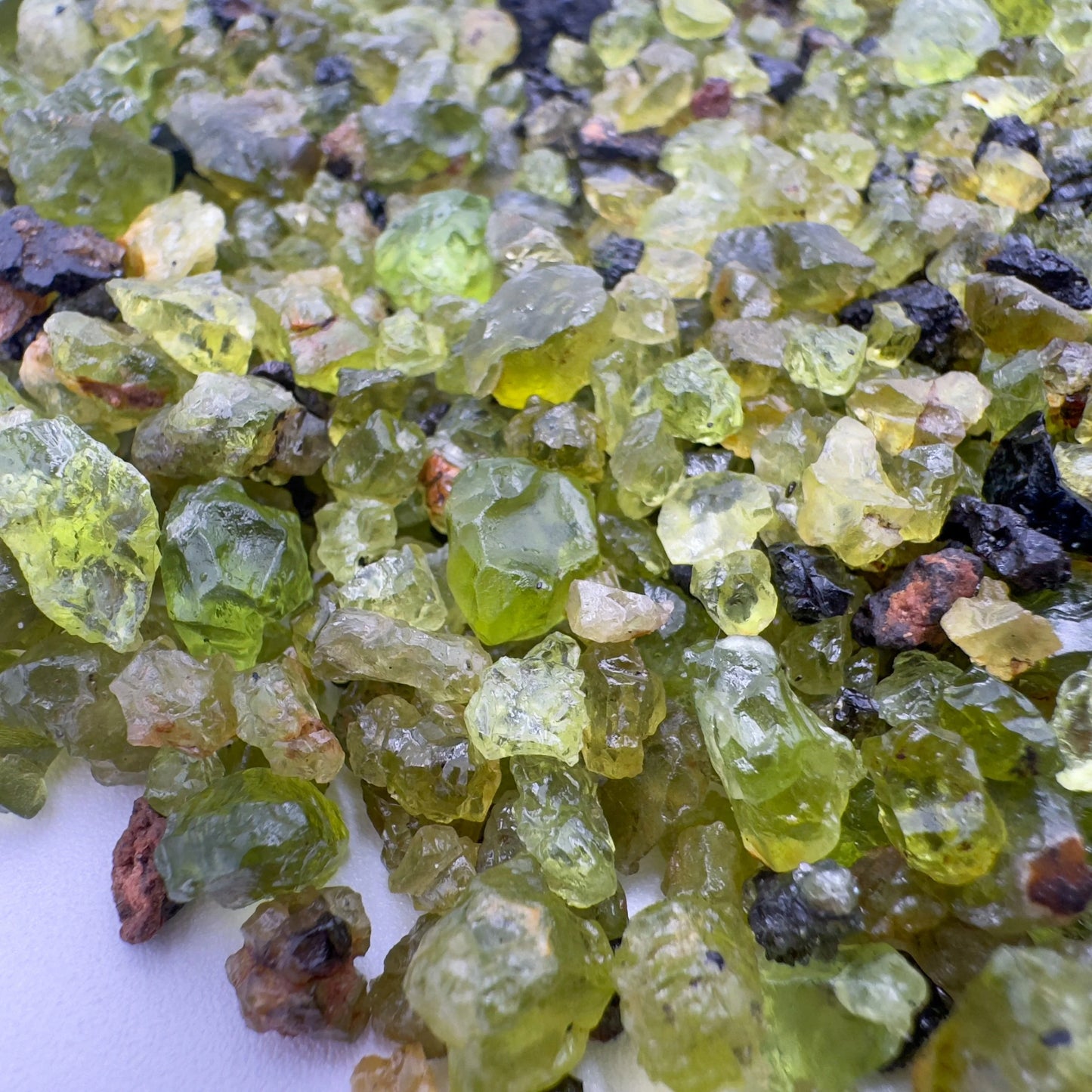 Top view of Grade AA Peridot raw, sourced from San Carlos Apache Reservation, Arizona, United States