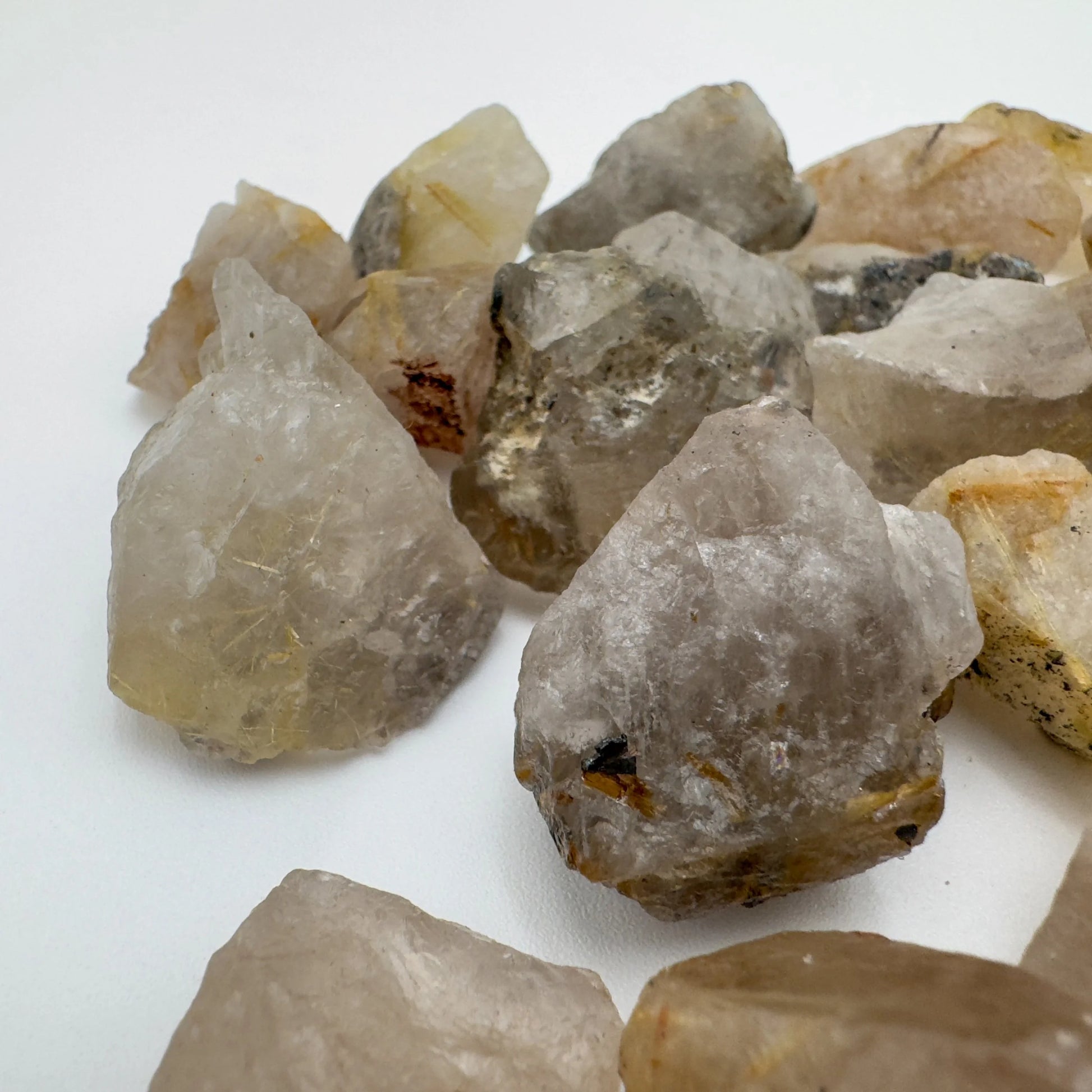 Overhead view of Grade A Quartz raw stone, showing subtle veining, Brazil-sourced.