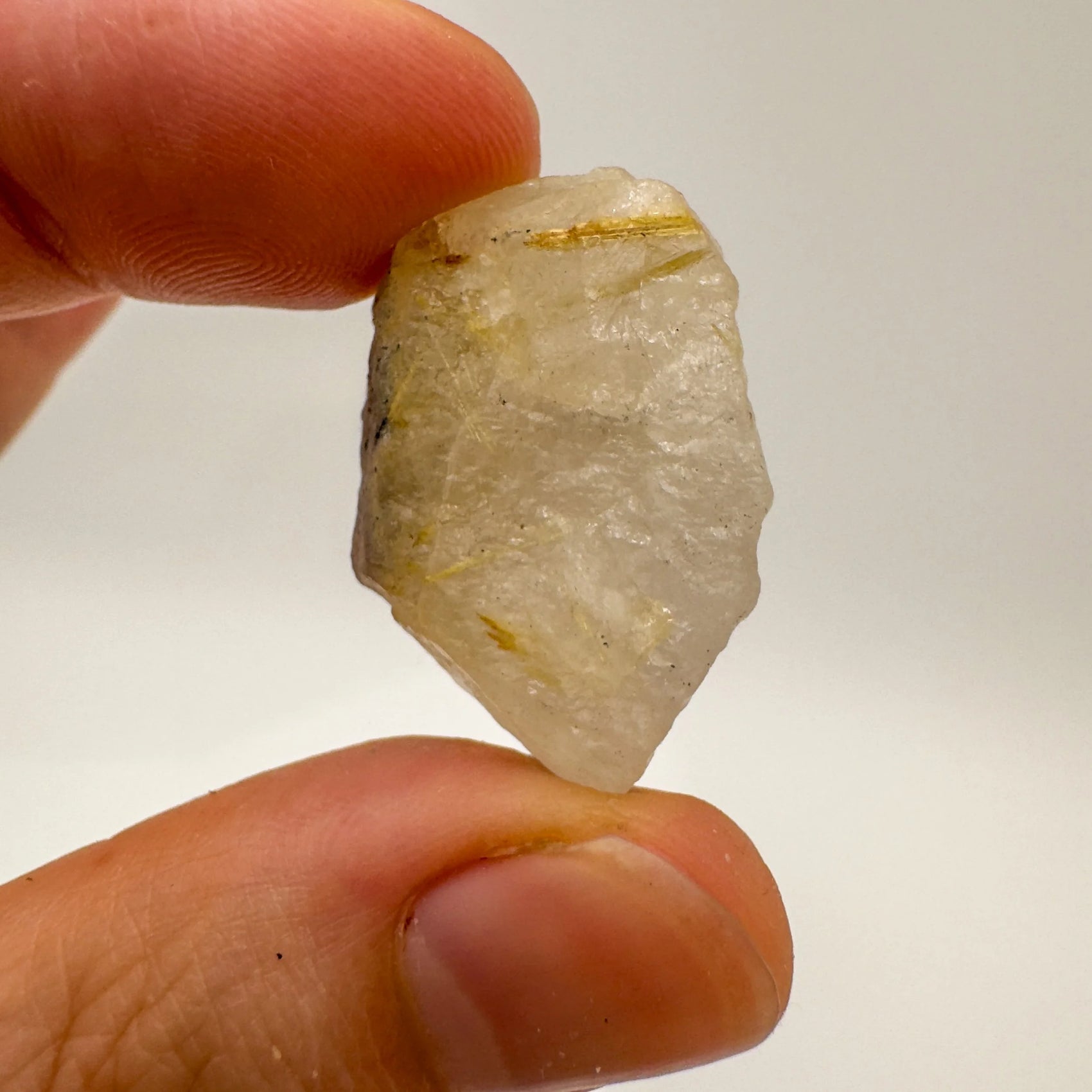 Back view of Grade A Quartz raw showing natural surface