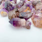 Top view of Smoky Amethyst raw point, showing natural sheen.