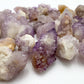 Overhead view of Grade AA Quartz raw stone, showing natural color depth.