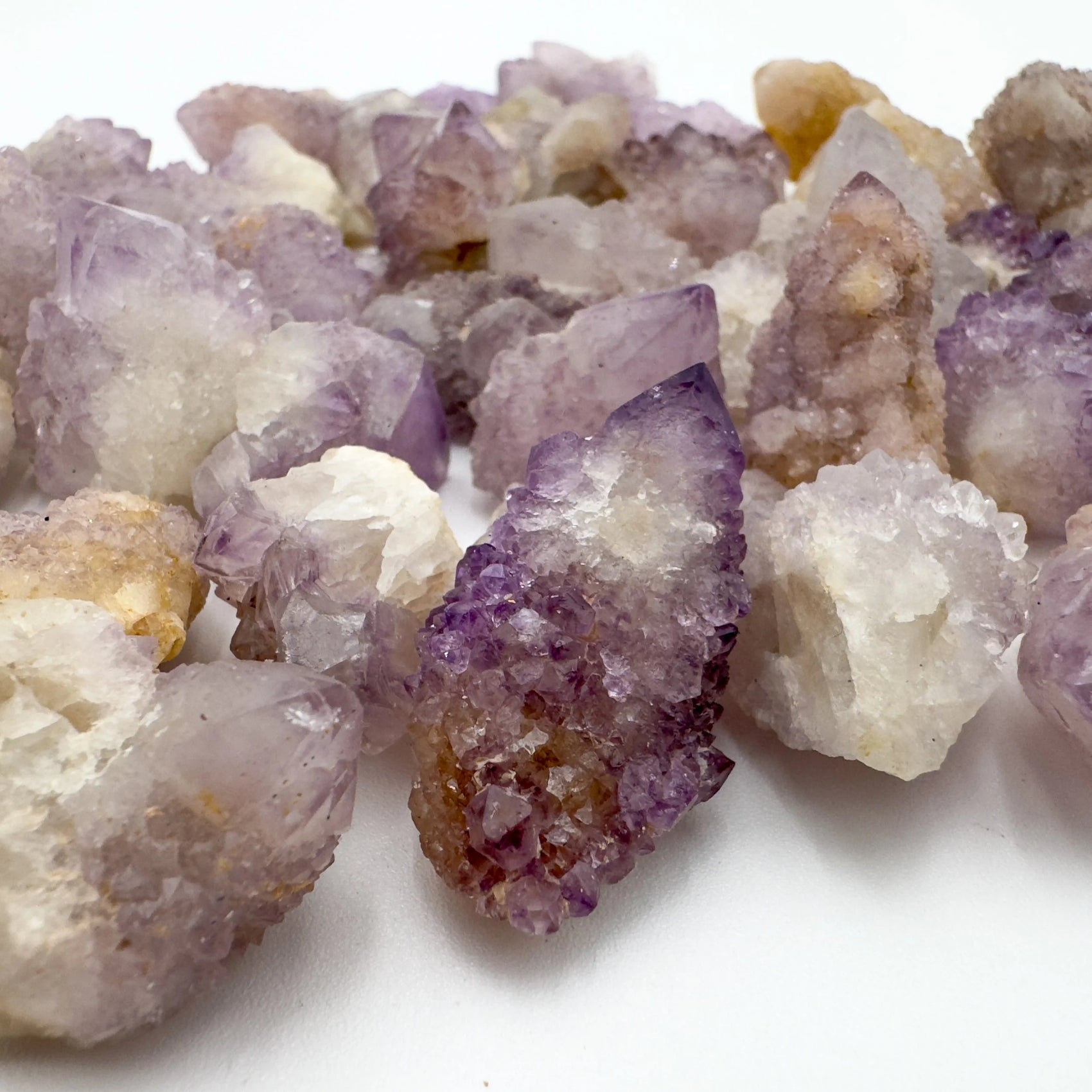 Overhead view of Grade AA Quartz raw stone, showing natural color depth.