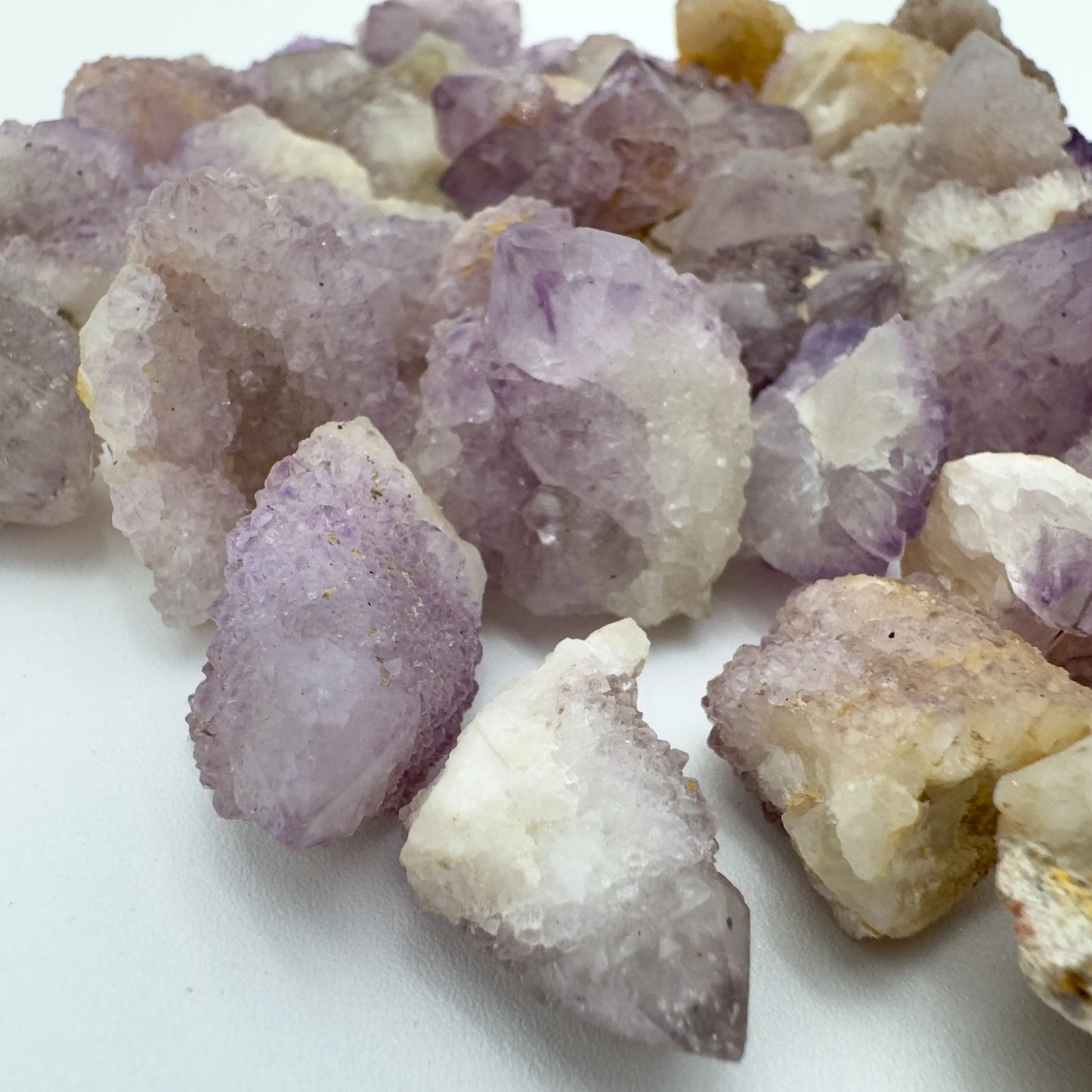 Hand-scale shot of a single Quartz raw stone South Africa-sourced.