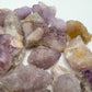 Grade aa quartz raw held in hand for size reference