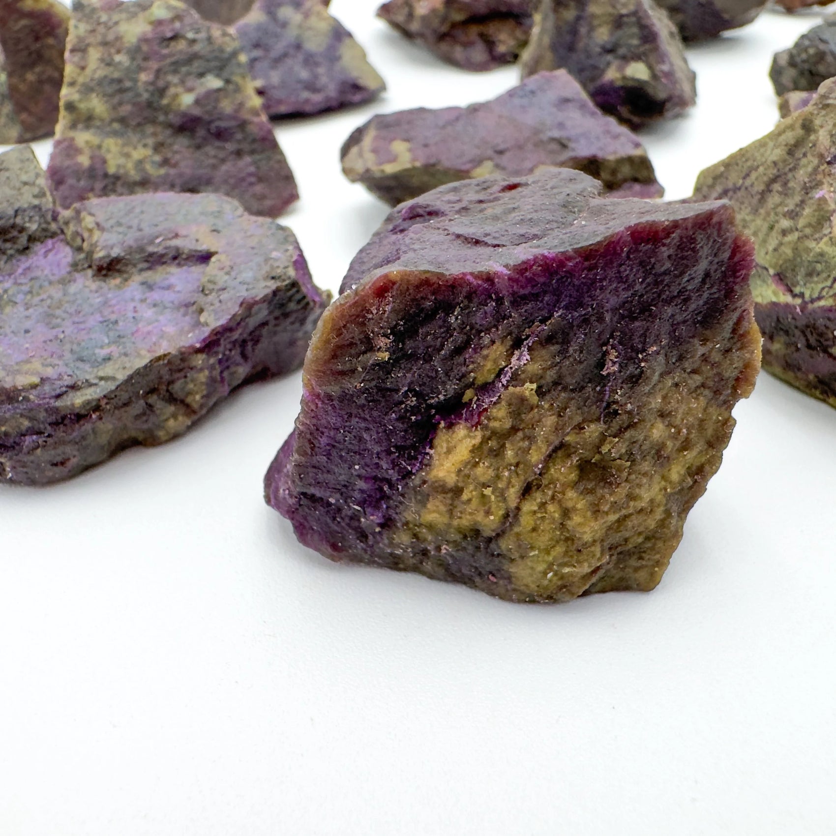 Side profile of Stichtite raw stone, showing honest grain.