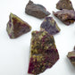 Overhead view of purple Stichtite raw stone, sourced from South Africa, showing characteristic patterning.