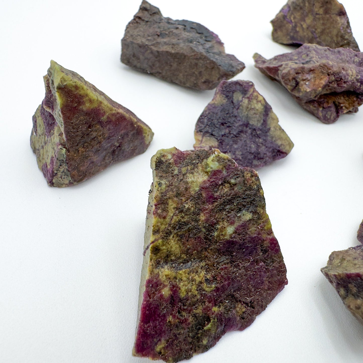 Overhead view of purple Stichtite raw stone, sourced from South Africa, showing characteristic patterning.