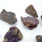 Daylight detail of Stichtite raw crystal, from Mpumalanga, South Africa, linked to Healing, shown for proportion against the hand.