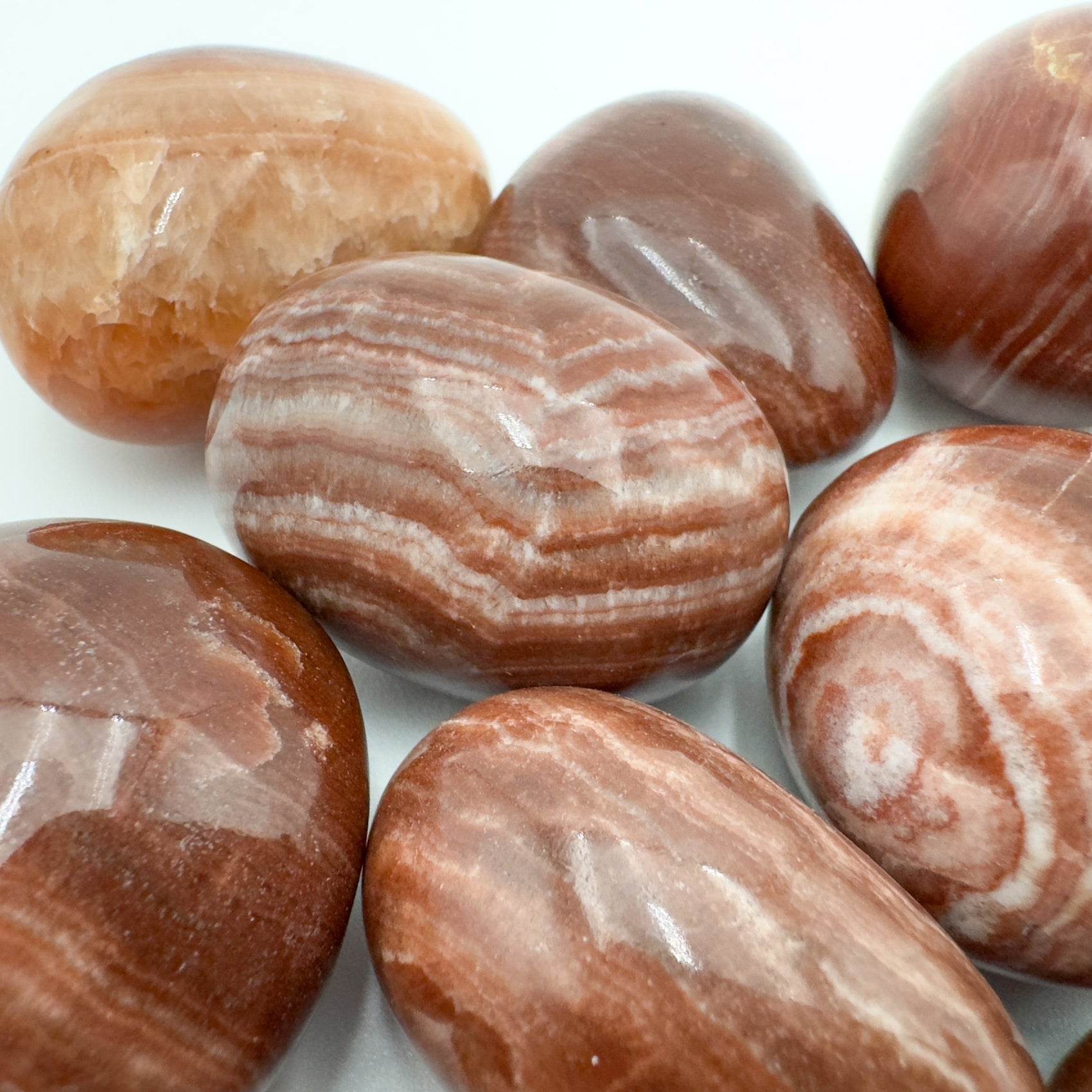 Underside detail of Red Aragonite tumbled stone, for Energy.