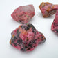 Size comparison with a Rhodonite raw stone, from Zimbabwe.