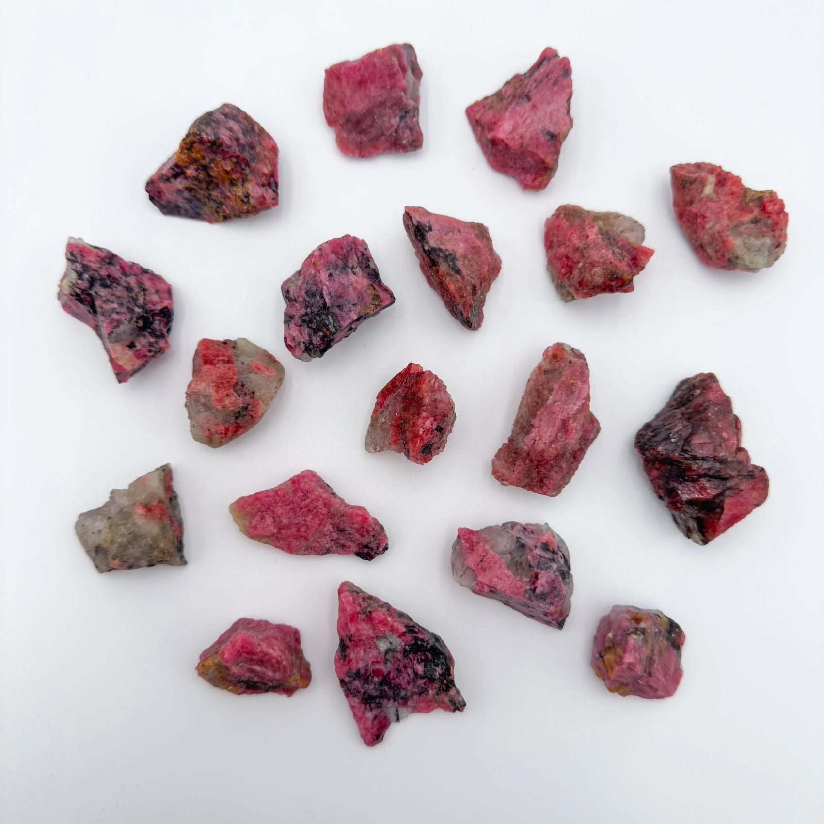 Close-up of Rhodonite raw stone from Zimbabwe, soothing wellness stone for Emotional Healing