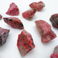 Detail shot of Grade AA Rhodonite raw under natural light