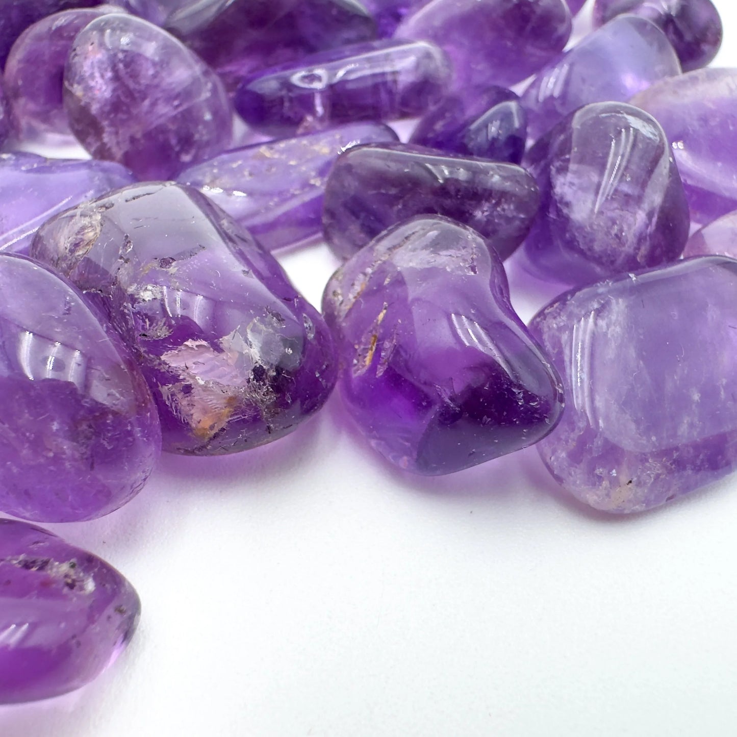 Underside detail of Grade AAA purple Amethyst tumbled stone, from Rio Grande do Sul, Brazil, for Stress Relief and Sleep.